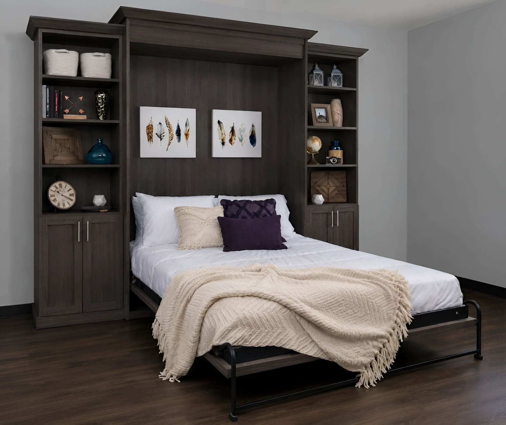 The same grey walnut wall bed open, the queen bed down between its two display towers