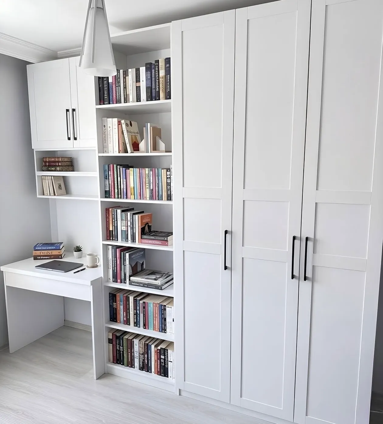 A white shaker wardrobe run to the ceiling beside a built-in desk and a full-height bookcase, in a Scarborough bedroom